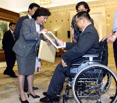 Tanaka meets Deng Xiaoping's son